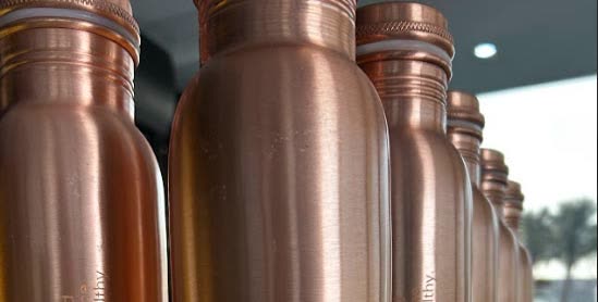 A row of copper bottles