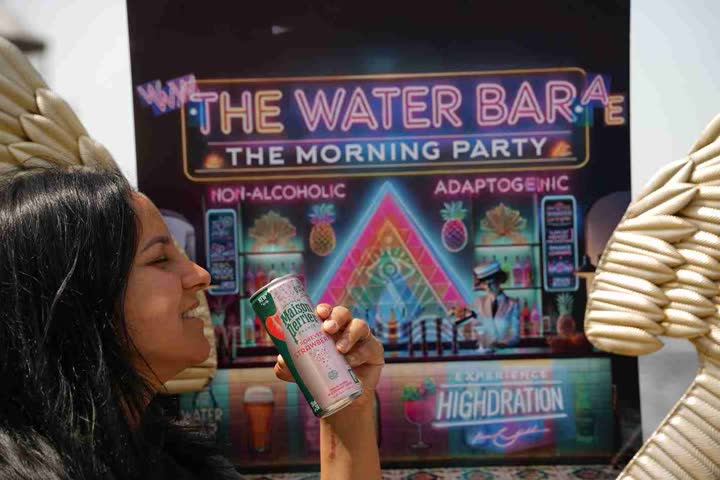 A guest drinking from a can at The Water Bar